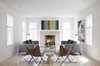 Modern home with Living Room, Chair, Sofa, Coffee Tables, Light Hardwood Floor, Wood Burning Fireplace, and Recessed Lighting. Livingroom Photo of Clifford Residence