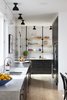 Modern home with Kitchen, Marble Counter, Light Hardwood Floor, Subway Tile Backsplashe, Ceiling Lighting, Refrigerator, and Undermount Sink. Kitchen Photo 4 of Clifford Residence