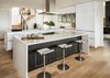Modern home with Kitchen, Engineered Quartz Counter, White Cabinet, Light Hardwood Floor, Range Hood, and Cooktops. Kitchen Photo 10 of River Garden Trail Residence