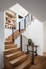 Modern home with Staircase, Metal Railing, and Wood Tread. Stairs Photo 2 of River Garden Trail Residence