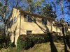Front Exterior Before Photo 4 of split-level transformed west coast modern modern home