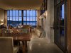 Modern home with Dining Room, Bench, Concrete Floor, Table, Standard Layout Fireplace, Wall Lighting, Ceiling Lighting, Chair, and Wood Burning Fireplace. The Pierre | Olson Kundig Photo 6 of The Pierre