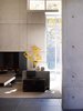 Modern home with Exterior, Metal, Wood, Sofa, Ceiling Lighting, Coffee Tables, Table, Pendant Lighting, and Living Room. Northwoods House Photo 9 of Northwoods House
