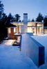 Modern home with Garden, Metal, Wood, Exterior, Bed, Coffee Tables, Table, Closet Storage Type, Storage, Concrete Patio, Porch, Deck, Outdoor, Side Yard, Front Yard, and Back Yard. Northwoods House Photo 15 of Northwoods House