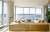Modern home with Living Room, Sectional, Coffee Tables, Sofa, and End Tables. Harbor Loft | Olson Kundig Photo 4 of Harbor Loft