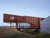 Modern home with House, Metal Roof Material, Metal Siding Material, Outdoor, Side Yard, Back Yard, Concrete Patio, Porch, Deck, Front Yard, and Large Patio, Porch, Deck. Rimrock | Olson Kundig Photo 14 of Rimrock