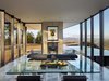 Modern home with Living Room, Sofa, Sectional, Chair, Two-Sided Fireplace, and Ceiling Lighting. Rimrock | Olson Kundig Photo 8 of Rimrock