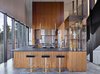 Modern home with Kitchen, Wood Cabinet, Pendant Lighting, Range, Drop In Sink, Refrigerator, and Range Hood. Rimrock | Olson Kundig Photo 9 of Rimrock