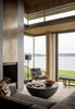 Modern home with Living Room, Standard Layout Fireplace, Sofa, Recessed Lighting, Chair, Sectional, and Bench. Fox Island Residence | Olson Kundig Photo 6 of Fox Island Residence