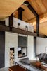 Modern home with Living Room, Concrete Floor, Sofa, Two-Sided Fireplace, Wood Burning Fireplace, and Coffee Tables. Trout Lake | Olson Kundig Photo 9 of Trout Lake