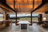 Modern home with Dining Room, Chair, Table, Concrete Floor, Pendant Lighting, Bar, and Stools. Trout Lake | Olson Kundig Photo 6 of Trout Lake