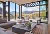 Modern home with Living Room, Medium Hardwood Floor, Chair, End Tables, Sofa, Coffee Tables, Ottomans, and Sectional. Lake Creek Residence | Olson Kundig Photo 8 of Lake Creek Residence