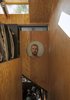 Modern home with Hallway. Agate Pass Cabin | New portions of the cabin are sheathed in plywood, juxtaposed against the stained cedar panels of the original cabin | 'Finn' by Leiv Fagereng, a portrait painted on wood panel. Photo 12 of Agate Pass Cabin