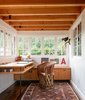 Modern home with Office, Study Room Type, Desk, Storage, and Chair. Agate Pass Cabin | The former porch was transformed into an office and dining room. Photo 3 of Agate Pass Cabin