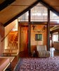 Modern home with Living Room and Chair. Agate Pass Cabin | A new structural steel moment frame secures all levels of the house to the foundation. The exposed frame screens the bedroom loft. | Artwork: Untitled WJ-1 by Portland artist Leiv Fagereng | : ) is a cast bronze portrait of a security surveillance system by the art collective Sutton/Beres/Culler. For Maskin, the piece references the idea of home surveillance as it relates to neighbors and neighborhoods. Photo 11 of Agate Pass Cabin