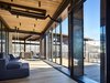 Modern home with Living Room, Sectional, Sofa, and Chair. Bigwood Residence | Olson Kundig Photo 14 of Bigwood Residence