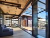 Modern home with Living Room, Sofa, Chair, and Sectional. Bigwood Residence | Olson Kundig Photo 16 of Bigwood Residence