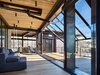 Modern home with Living Room, Sofa, Sectional, and Chair. Bigwood Residence | Olson Kundig Photo 15 of Bigwood Residence