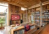 Modern home with Living Room, Sofa, End Tables, Sectional, Concrete Floor, Bookcase, and Coffee Tables. City Cabin | Olson Kundig Photo 9 of City Cabin