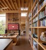 Modern home with Living Room, Bookcase, Sectional, Concrete Floor, End Tables, Console Tables, and Coffee Tables. City Cabin | Olson Kundig Photo 17 of City Cabin