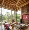Modern home with Living Room, Concrete Floor, Sectional, Sofa, Chair, Console Tables, Coffee Tables, and End Tables. City Cabin | Olson Kundig Photo 10 of City Cabin