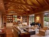Modern home with Living Room, Ceiling Lighting, Sofa, Console Tables, Chair, Bookcase, Recessed Lighting, Coffee Tables, and Pendant Lighting. Country Garden House | Olson Kundig Photo 10 of Country Garden House