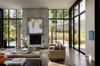 Modern home with Living Room, Recessed Lighting, Coffee Tables, Two-Sided Fireplace, End Tables, Sofa, and Console Tables. Stirrup House | Olson Kundig Photo 6 of Stirrup House