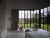 Modern home with Chair and Recessed Lighting. Millerton Farmhouse | Olson Kundig Photo 14 of Millerton Farmhouse