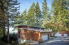 Modern home with Exterior, House Building Type, Wood Siding Material, Curved RoofLine, and Concrete Siding Material. Wave House | Olson Kundig Photo 5 of Wave House