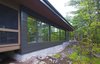 Modern home with Outdoor, Trees, Grass, and Boulders. Frontenac House - Exterior Photo 2 of Frontenac House