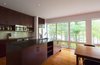 Modern home with Kitchen, Wood Cabinet, Medium Hardwood Floor, Subway Tile Backsplashe, Ceiling Lighting, Refrigerator, Range, Microwave, and Undermount Sink. Frontenac House - Kitchen Photo 7 of Frontenac House