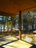 Modern home with Outdoor, Trees, Boulders, Wood Patio, Porch, Deck, Concrete Patio, Porch, Deck, and Vertical Fences, Wall. Frontenac House - Porch Photo 10 of Frontenac House