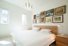 Modern home with Bedroom, Night Stands, Bed, Table Lighting, Ceiling Lighting, Lamps, Pendant Lighting, Accent Lighting, and Light Hardwood Floor. Our House - Master Bedroom Photo 7 of Our House