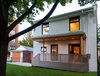 Modern home with Outdoor, Trees, Grass, Front Yard, Wood Patio, Porch, Deck, Wood Fences, Wall, Horizontal Fences, Wall, and Small Patio, Porch, Deck. Our House - Exterior Photo of Our House