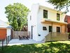 Modern home with Outdoor, Front Yard, Grass, Wood Patio, Porch, Deck, Trees, Small Patio, Porch, Deck, Wood Fences, Wall, and Horizontal Fences, Wall. Our House - Exterior Photo 3 of Our House
