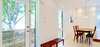 Modern home with Bench, Ceiling Lighting, Light Hardwood Floor, Dining Room, Table, Chair, and Storage. Our House - Front Door Photo 10 of Our House