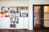 Modern home with Wall Lighting, Bookcase, Shelves, Storage, Medium Hardwood Floor, Family Room, Living Room, Craft Room, Library, Kids Room, Study, and Dark Hardwood Floor. Bickford Park - Music Room Photo of Bickford Park