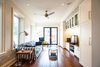 Modern home with Living Room, Sofa, Coffee Tables, End Tables, Media Cabinet, Lamps, Ceiling Lighting, Storage, and Dark Hardwood Floor. Bickford Park - Living Room Photo 14 of Bickford Park