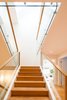 Modern home with Wood Tread, Glass Railing, Hallway, and Medium Hardwood Floor. Edwardian Renovation - Stairs Photo 7 of Edwardian Renovation