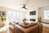 Modern home with Living Room, Sectional, Console Tables, Coffee Tables, Ceiling Lighting, Medium Hardwood Floor, Accent Lighting, Ribbon Fireplace, and Gas Burning Fireplace. Edwardian Renovation - Great Room Photo 5 of Edwardian Renovation