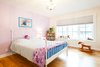 Modern home with Kids Room, Medium Hardwood Floor, Bed, Bookcase, Bedroom Room Type, and Girl Gender. Edwardian Renovation - Kids Bedroom Photo 9 of Edwardian Renovation