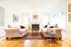Modern home with Living Room, Ceiling Lighting, Sofa, Coffee Tables, Medium Hardwood Floor, Standard Layout Fireplace, Gas Burning Fireplace, and End Tables. Edwardian Renovation - Living Room Photo 13 of Edwardian Renovation