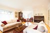 Modern home with Living Room, Coffee Tables, Bench, Ceiling Lighting, Chair, and Medium Hardwood Floor. Edwardian Renovation - Living Room Photo 14 of Edwardian Renovation