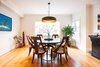 Modern home with Dining Room, Chair, Pendant Lighting, Table, Ceiling Lighting, Accent Lighting, and Medium Hardwood Floor. Edwardian Renovation - Dining Room Photo 2 of Edwardian Renovation