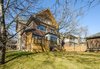 Modern home with Outdoor, Trees, Slope, Grass, Back Yard, Small Patio, Porch, Deck, Wood Patio, Porch, Deck, Vertical Fences, Wall, and Wood Fences, Wall. Edwardian Renovation - Exterior Photo 3 of Edwardian Renovation