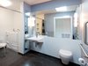 Modern home with Bath Room, Ceiling Lighting, Wall Lighting, One Piece Toilet, and Wall Mount Sink. Roncesvalles Accessible House - Master Bathroom Photo 4 of Roncesvalles Accessible House