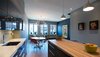 Modern home with Pendant Lighting, Ceiling Lighting, Light Hardwood Floor, Accent Lighting, Chair, Table, Wood Counter, Undermount Sink, Dining Room, and Bar. Elgin Loft - Great Room Photo 7 of Elgin Loft