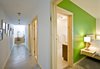 Modern home with Concrete Floor, Bedroom, Night Stands, and Bed. Gananoque Lake Road House - Downstairs Hallway Photo 10 of Gananoque Lake Road House