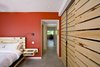 Modern home with Bed, Concrete Floor, Ceiling Lighting, Night Stands, Wall Lighting, Storage Room, and Closet Storage Type. Gananoque Lake Road House - Master Bedroom Photo 2 of Gananoque Lake Road House