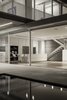 The construction technology allows the usage of big openings, a wide open floor plan and the hovering of the upper mass into the open view.
Photo 11 of The Dual House modern home